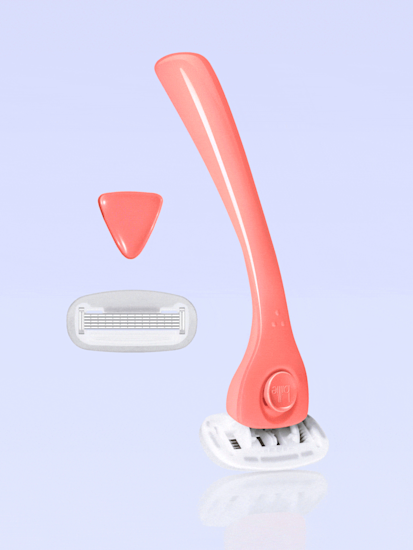 Billie Coral razor, magnetic holder, & extra blade on a light periwinkle background